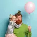 man-with-ginger-beard-his-daughter-with-party-accessories